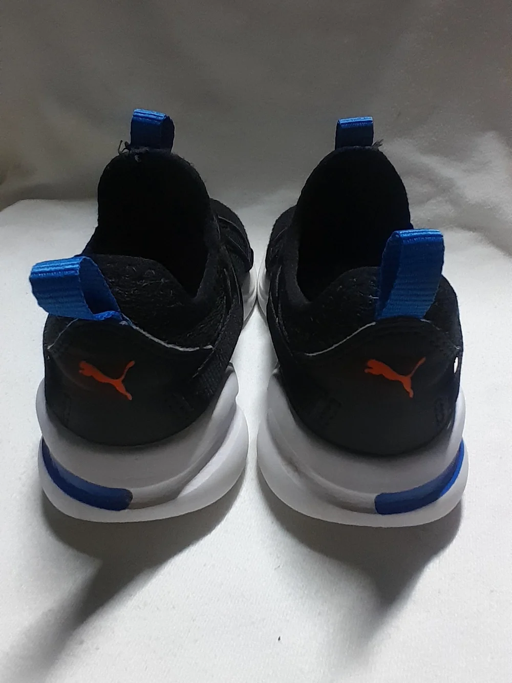 Puma Kids Black Sneakers with Orange Logo and Blue Accents